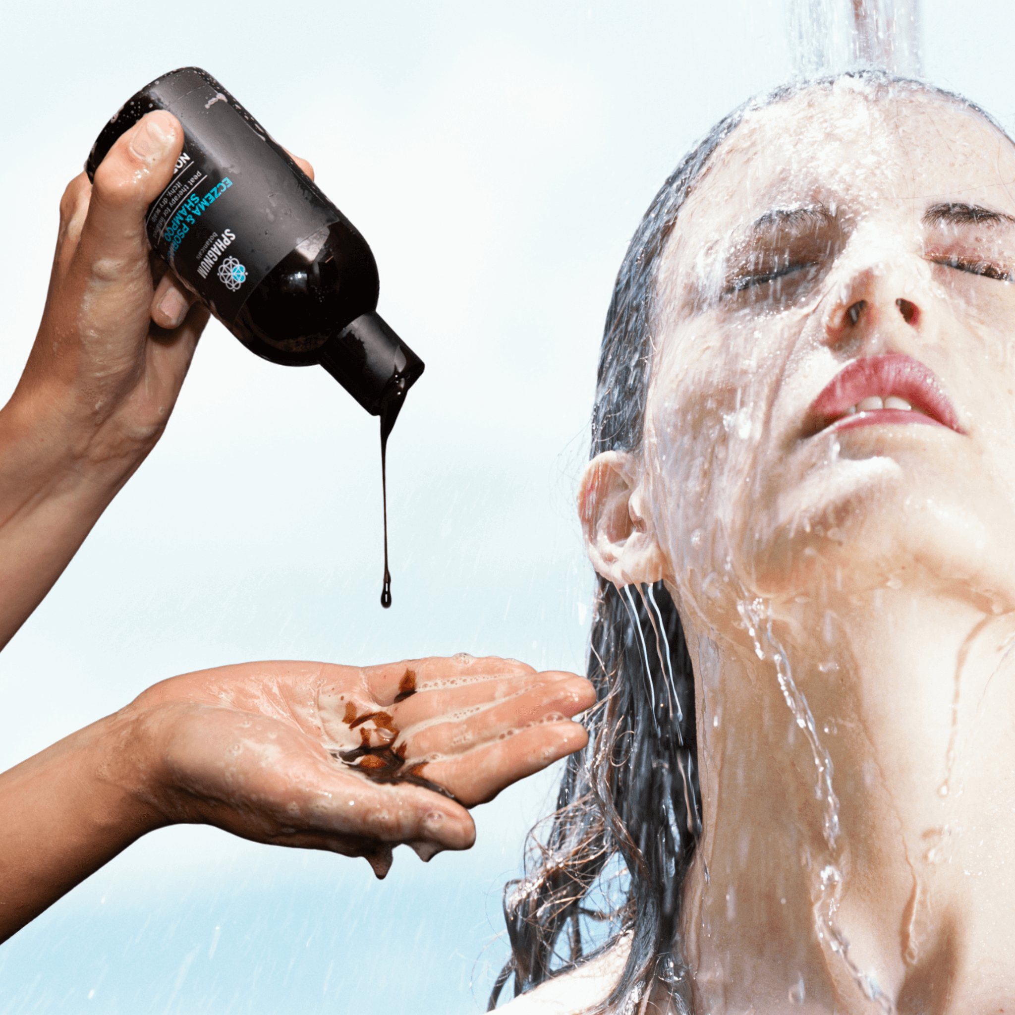 Sphagnum Botanicals shampoo with natural dark color poured by hand and woman under shower with wet hair and eyes closed.